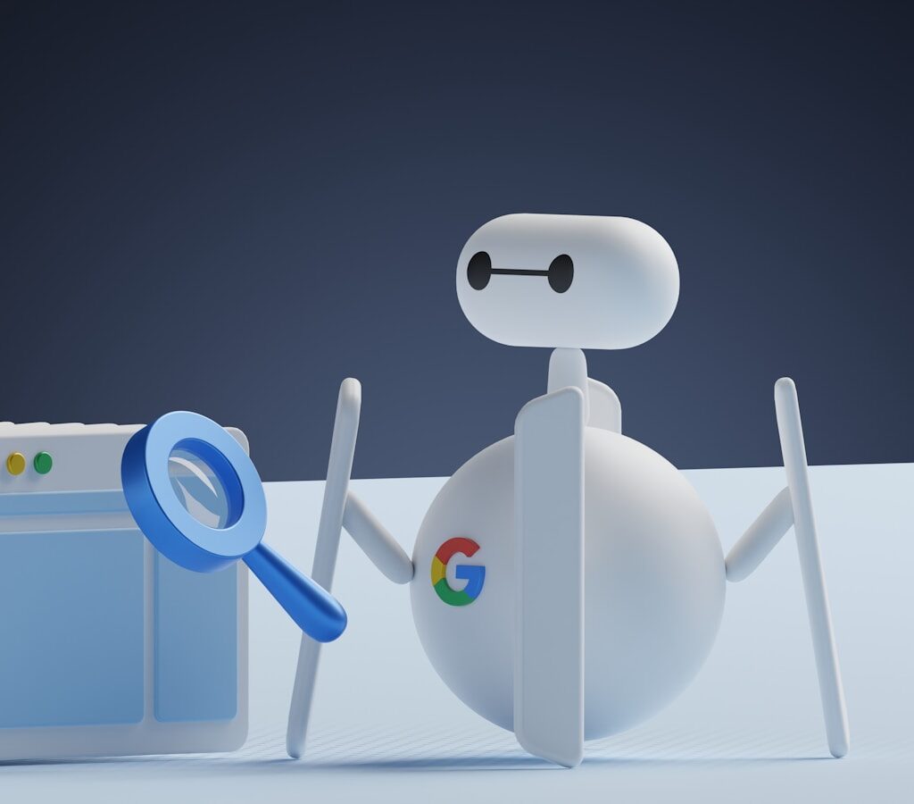 a white robot holding a magnifying glass next to a white box