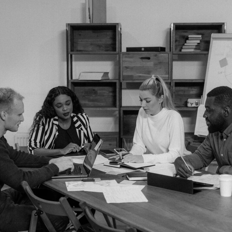 Monochrome Photo of Colleagues having Meeting