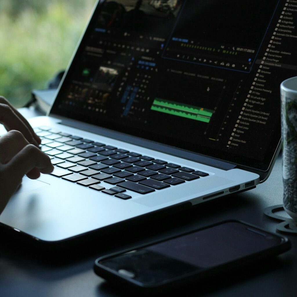 person using black and gray laptop computer